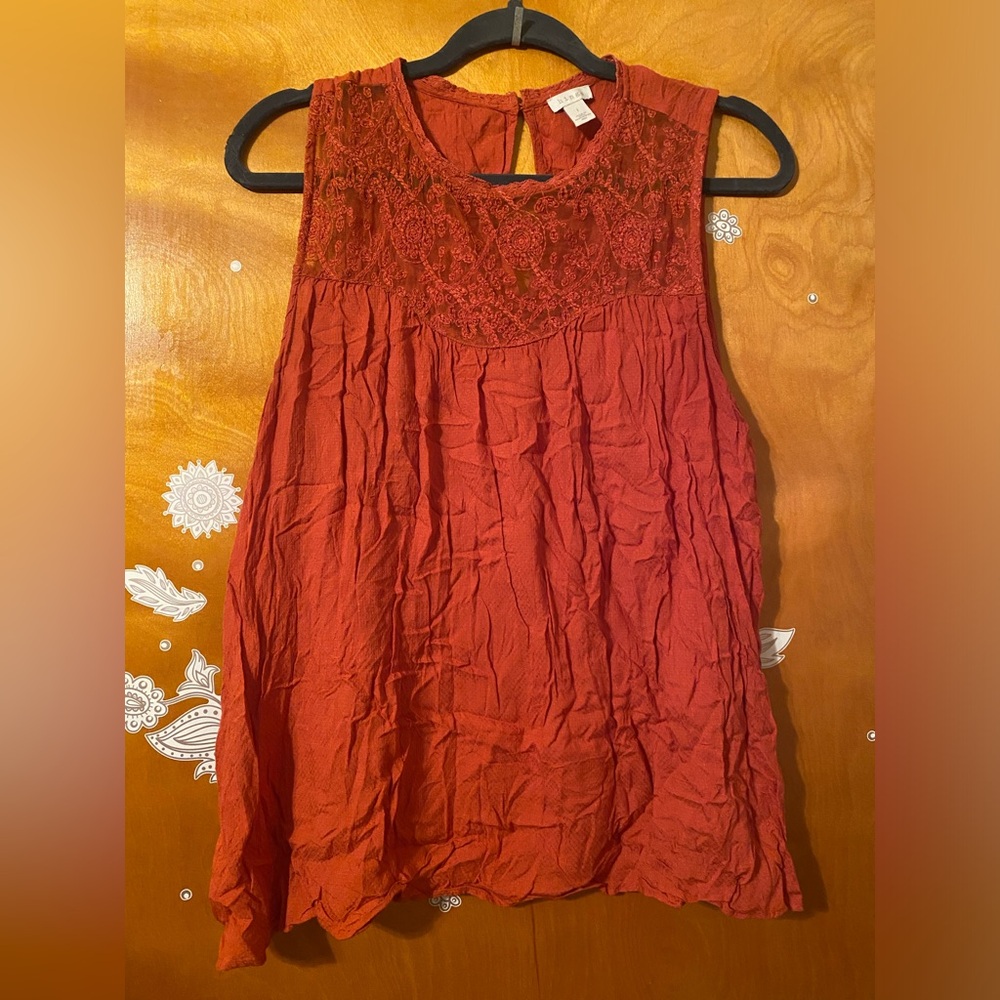 Reddish orange Hinge top. Made in India